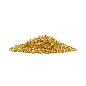 Heap of shiny golden corn kernels on a flat surface with a black background.