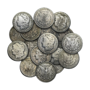 A pile of well-worn Cull Silver Dollars, including various Morgan and Peace dollars, with noticeable wear but retaining their iconic designs of Liberty and an eagle.